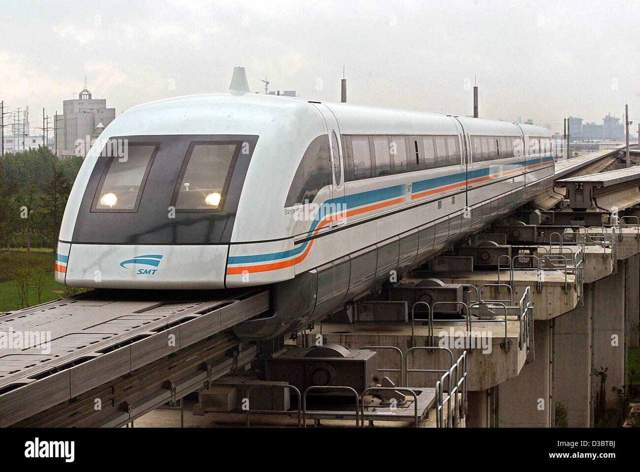 dpa) - The magnetic levitation (maglev) train Transrapid floats on a track  into the train station in Shanghai, 15 September 2003. The maglev, built  and designed by German engineering giants Siemens and