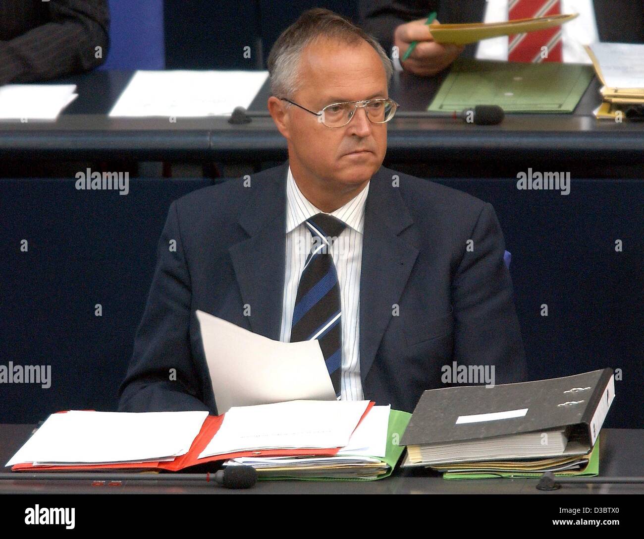 (dpa) - German Finance Minister Hans Eichel listens during the budget debate in the parliament in Berlin, 10 September 2003. Germany overshot the eurozone limit with an embarrassing 3.6 per cent last year and the government admits it will do so again in 2003. Many analysts predict a third overshoot  Stock Photo