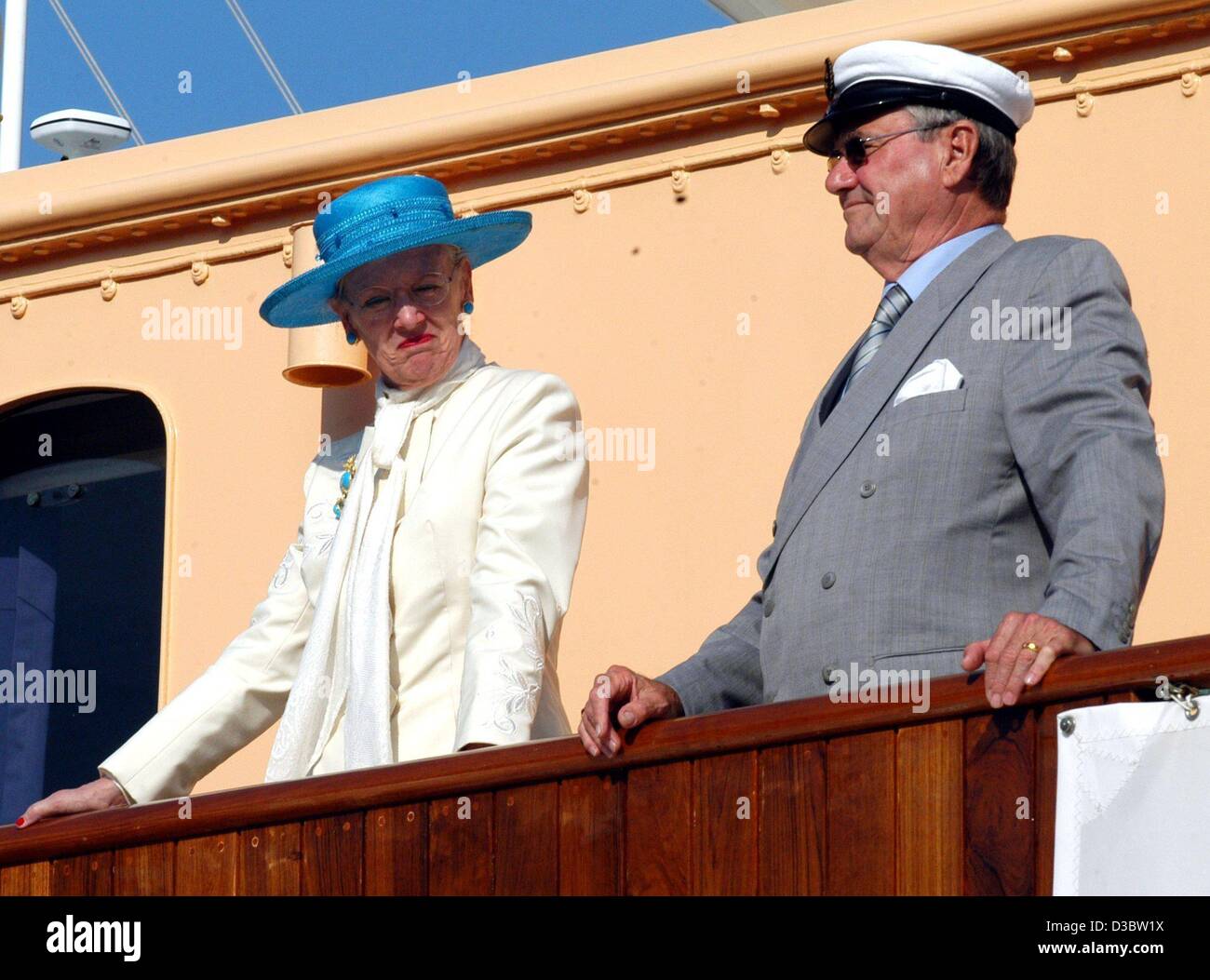 (dpa) - Queen Margrethe II of Denmark and her husband Prince Henrik stand on the deck of the royal yacht Dannebrog upon their arrival in Luebeck, Germany, 5 September 2003. Luebeck is the first stop of the Danish royal couple who are on an official visit to Germany. Stock Photo