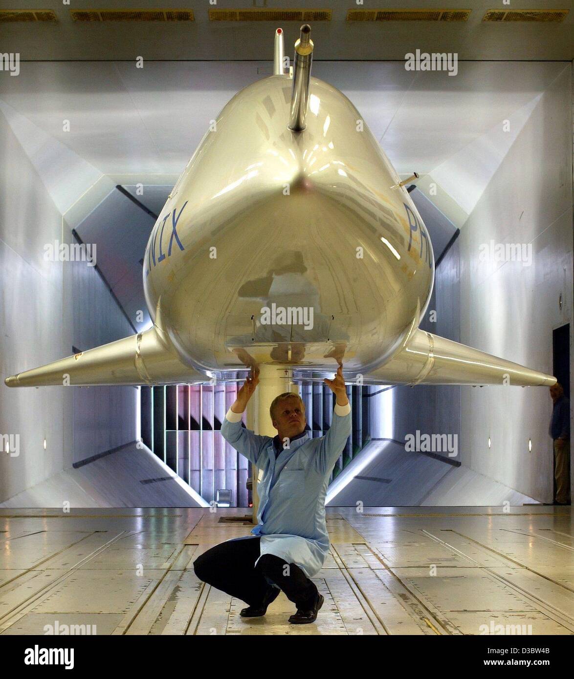 (dpa) - The EADS technician Torsten Vogel prepares the orbital glider Phoenix for an aerodynamic test in the Dutch-German wind tunnel in Marknesse, Netherlands, 20 August 2003. The Phoenix is a 1:7 model of a possible future orbital glider system 'Hopper'. Phoenix is used to collect data about the l Stock Photo
