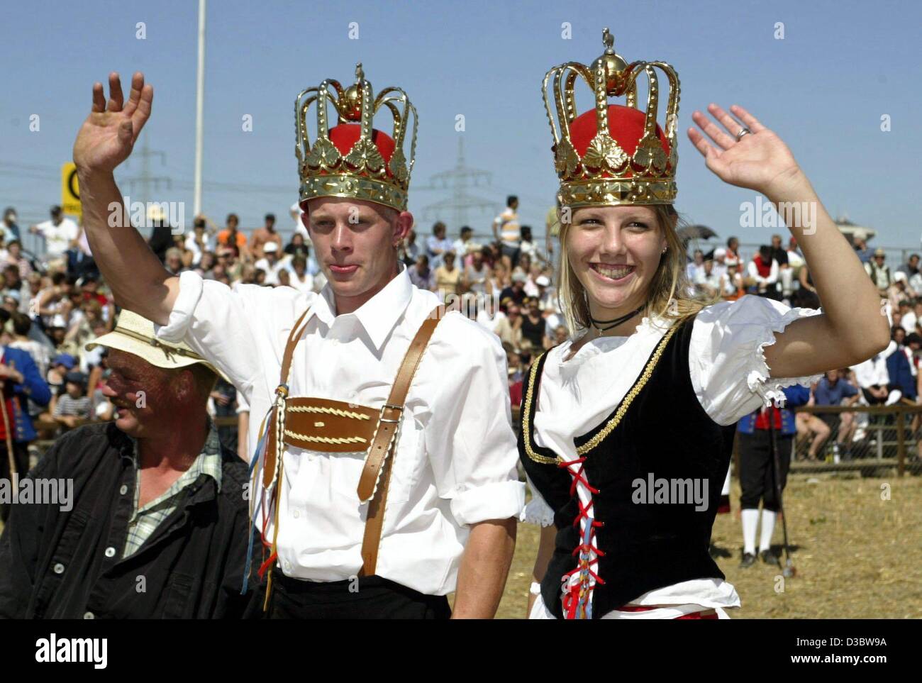 (dpa) - 15-year-old Elke Nagel and 23-year-old Stefan Giray are this year's royal couple after winning the traditional Sheperd's Run in Markgroeningen, southern Germany, 23 August 2003. They both won the race of running barefoot and in traditional costumes over a 300 feet long stubble field. The she Stock Photo
