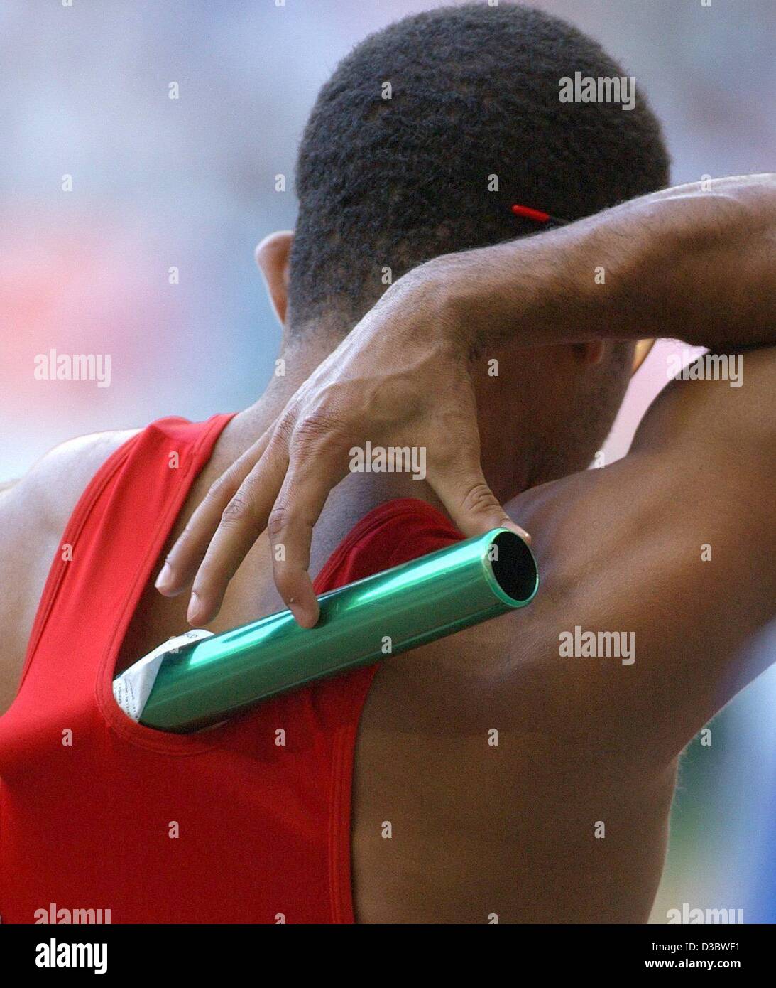 (dpa) - A runner from the Dominican Republic has stowed away the baton in his shirt ahead of the preliminaries of the men's 4x400 m relay at the 9th IAAF Athletic World Championships at the Stade de France in Paris, 30 August 2003. Stock Photo