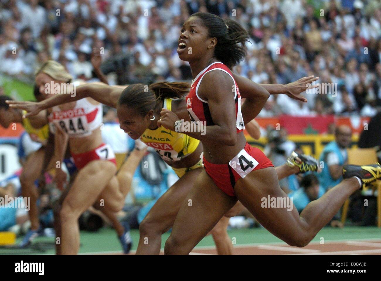 (dpa) - Canadian Perdita Felicien (R) wins the 100 m hurdles ahead of runner-up Jamaican Brigitte Foster (L) at the 9th IAAF Athletic World Championships at the Stade de France in Paris, 27 August 2003. Stock Photo