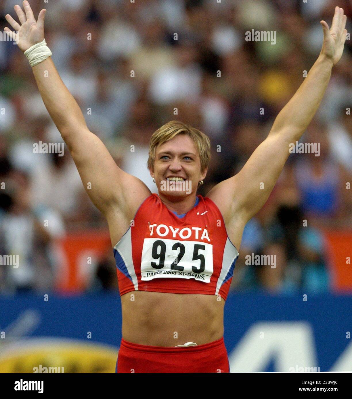 (dpa) - Russian Svetlana Krivelyova celebrates after winning the women's shot put competition at the 9th IAAF Athletics World Championships at the Stade de France in Paris, 27 August 2003. Stock Photo