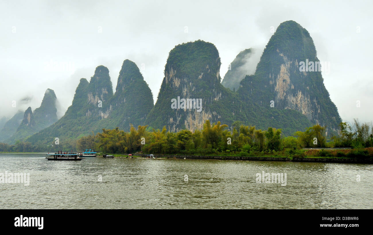 Limestone Outcroppings on a Foggy and Misty Day - Li River, Guilin, China Stock Photo