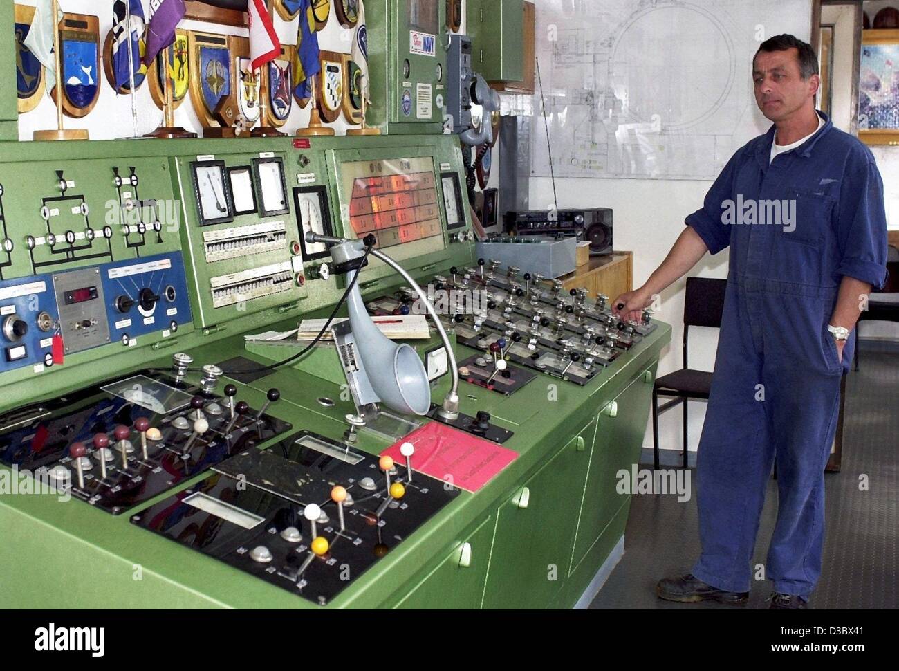 (dpa) - Wolfgang Klebowski stands at the control desk at the deep sea diving simulator for submarines in Kiel, Germany, 9 July 2003. A high pressure dock is serving as a simulator for submarines and is said to be unique in the world. During the simulation the density and stability of the submarines  Stock Photo