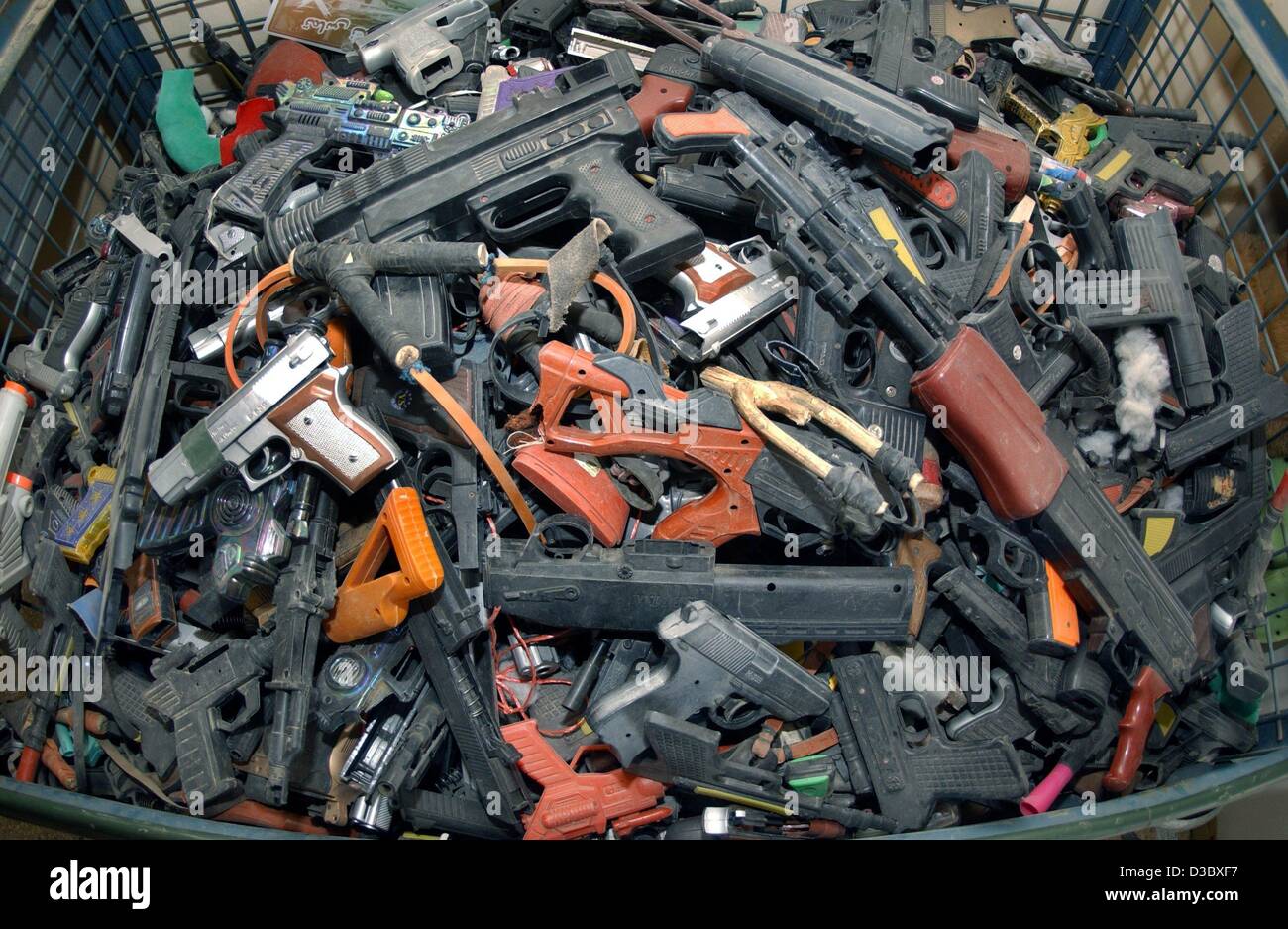 (dpa) - A view of a mountain of confiscated toy guns in a container on the premises of the German military camp in Kabul, Afghanistan, 5 August 2003. The toy guns are being collected in order to prevent children to get used to playing war games. The responsibility of public safety lies with the Inte Stock Photo