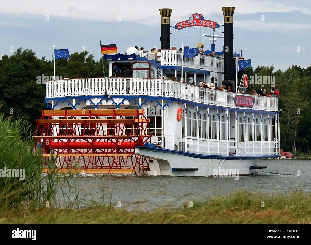(dpa) - Not on the Mississippi but on the Prerow River the paddle steamer River Star cruises along, in Born, northern Germany, 3 July 2003. The 33 m long ship was constructed in Kosel, Poland, and cruises daily on the lakes of the national park Vorpommersche Boddenlandschaft. Stock Photo