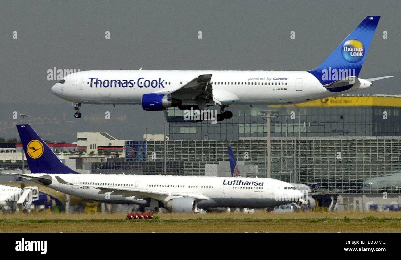 (dpa) - A Boeing 757 of the Thomas Cook Airlines (formerly Condor) is about to land at the airport in Frankfurt, 8 August 2003. In the background a plane of Lufthansa, the parent company of Thomas Cook Airlines. Stock Photo