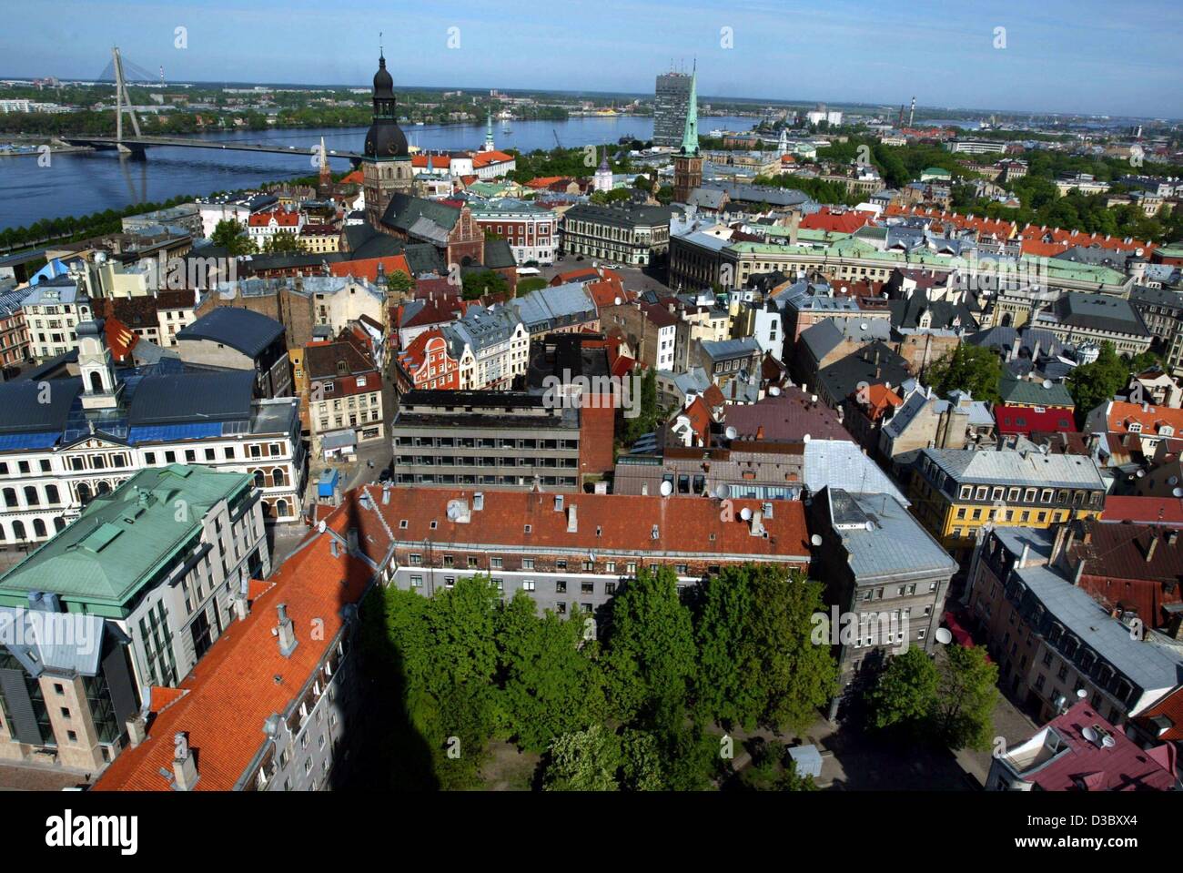 (dpa) - A view from the top of St Peter's Church over the city of Riga, Latvia, 22 May 2003. In the centre the black tower of the Dome Cathedral, to the right with the greenish tower St. Jacob's Church, in the background the Daugava River. Riga was once a major center of the Hanseatic League and pro Stock Photo