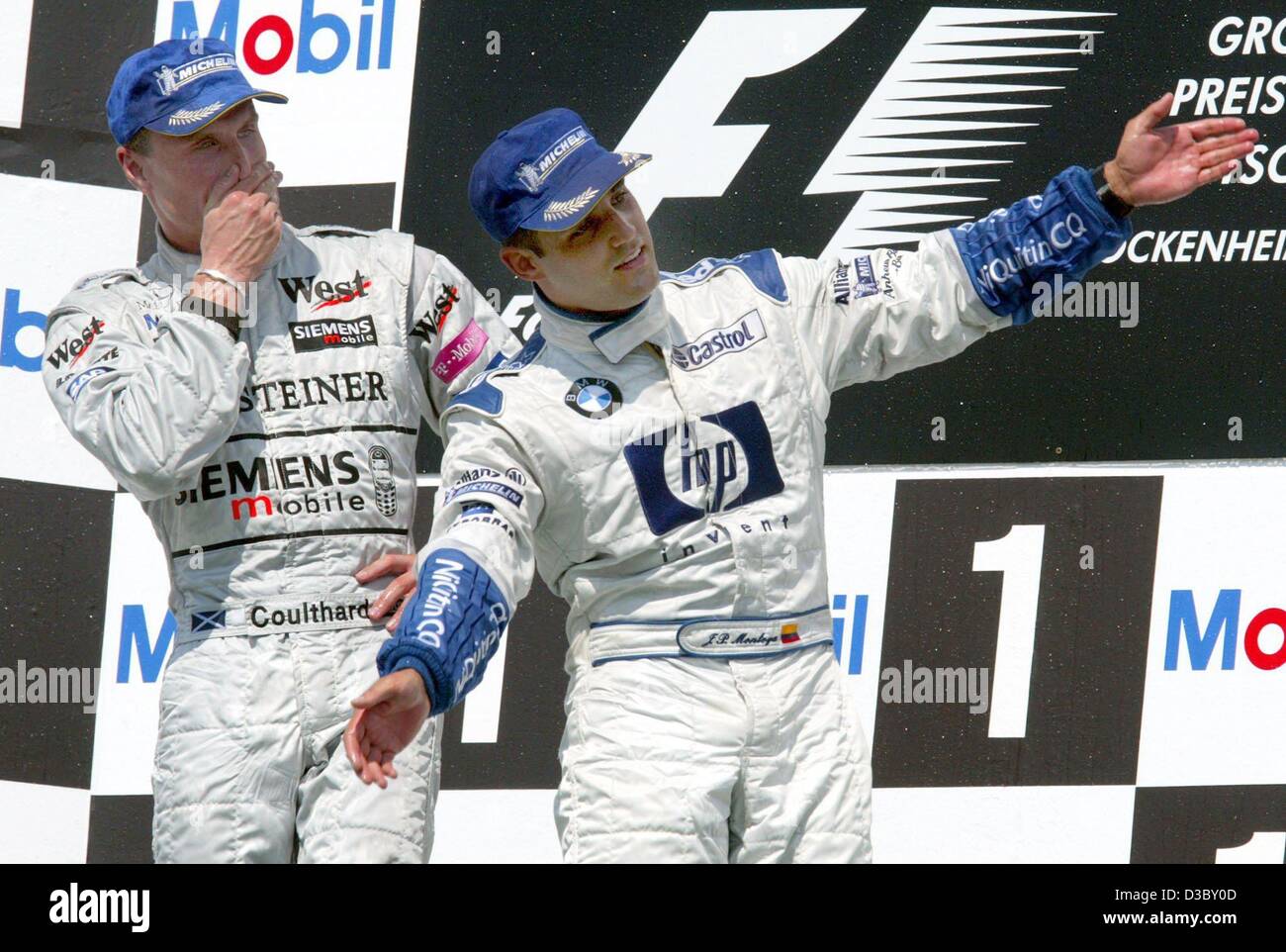 dpa) - Colombian Juan Pablo Montoya of BMW-Williams (R) celebrates on the  podium with second-placed David Coulthard of McLaren-Mercedes (L) after  winning the Formula One Grand Prix of Germany at the Hockenheim