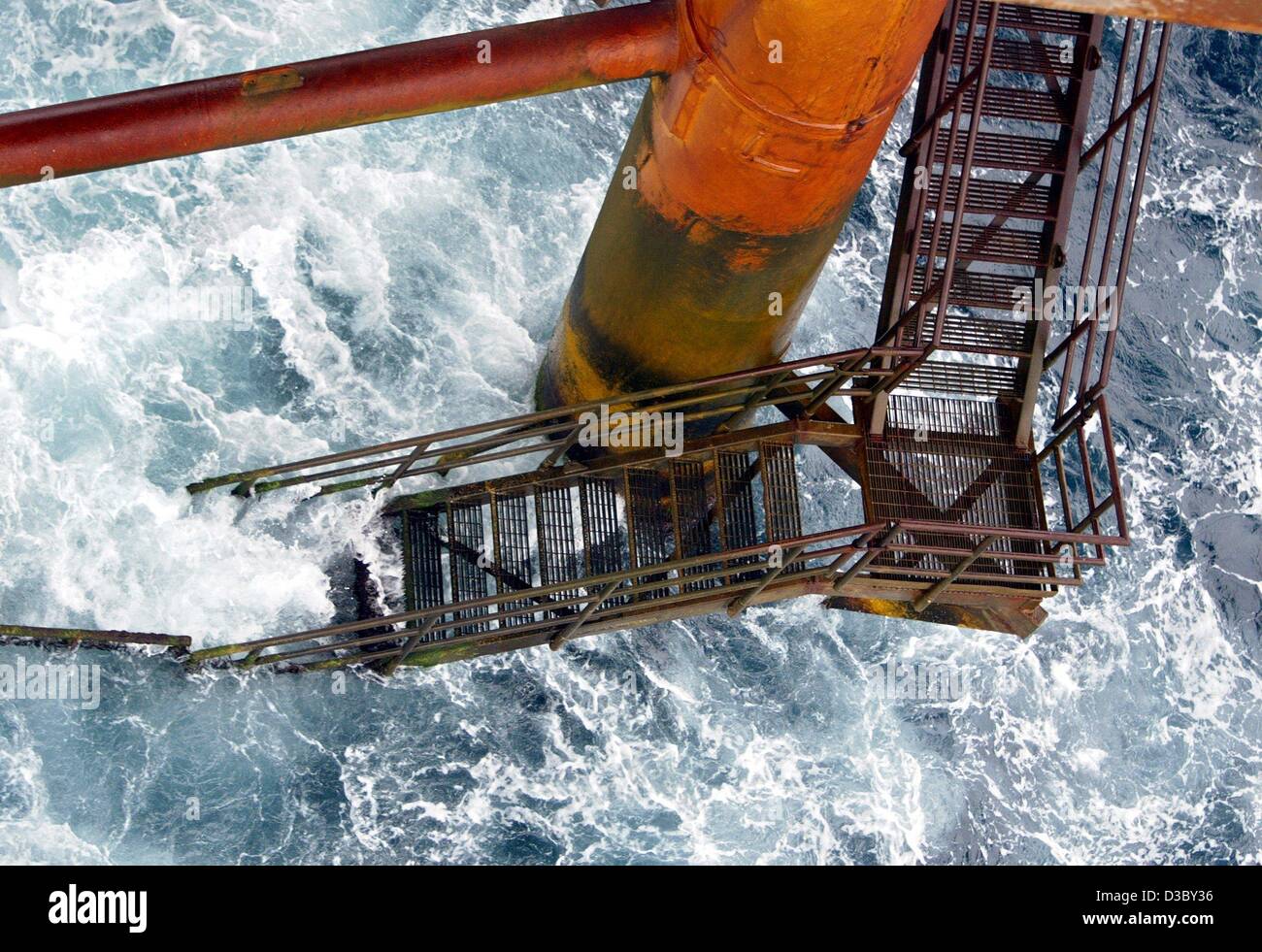 (dpa) - A security staircase leads down to the water level of the sea from a gas and oil rig in the North Sea, about 250 km offshore of Stavanger, Norway, 5 July 2003. The platform belongs to the Ekofisk field complex, which comprises the oil and gas rigs Ekofisk, Eldfisk, Embla and Tor. The workers Stock Photo