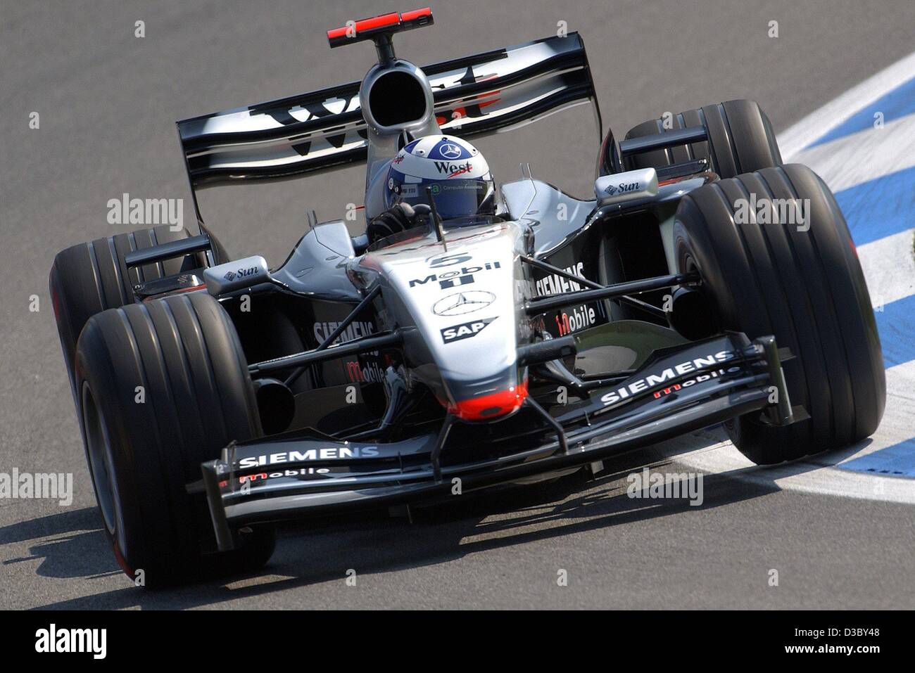 (dpa) - Scottish formula one pilot David Coulthard (McLaren-Mercedes) steers his bolide through a curve during the free training on the Hockenheimring race track in Hockenheim, Germany, 1 August 2003. He finishes with the best time. The 12th run of the world championships, the Grand Prix of Germany, Stock Photo