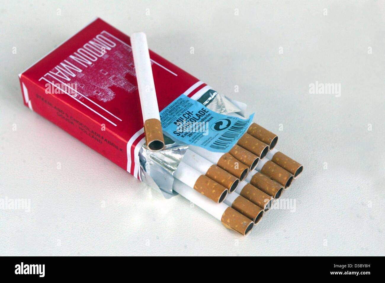 (dpa) - An opened pack of cigarettes made of chocolate lie on a table ...