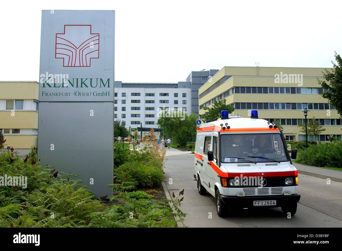 (dpa) - An ambulance leaves the clinic 'Klinikum Frankfurt' in Frankfurt Oder, eastern Germany, 29 July 2003. Two women have died in an outbreak of Legionnaires' disease in this hospital, and health officials said 29 July the bug seemed to have taken hold in the hospital hot-water pipes. The health  Stock Photo