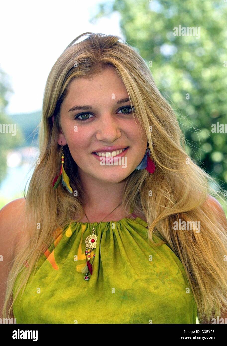 (dpa) - Ariana Savalas, daughter of the legendary actor Telly Savalas a.k.a. 'Kojak', smiles in Velden on Lake Woerthersee, Austria, 18 July 2003. Savalas' youngest daughter, now 16, wants to start her music career as a singer on Lake Woerthersee in August. She chose the location because it used to  Stock Photo