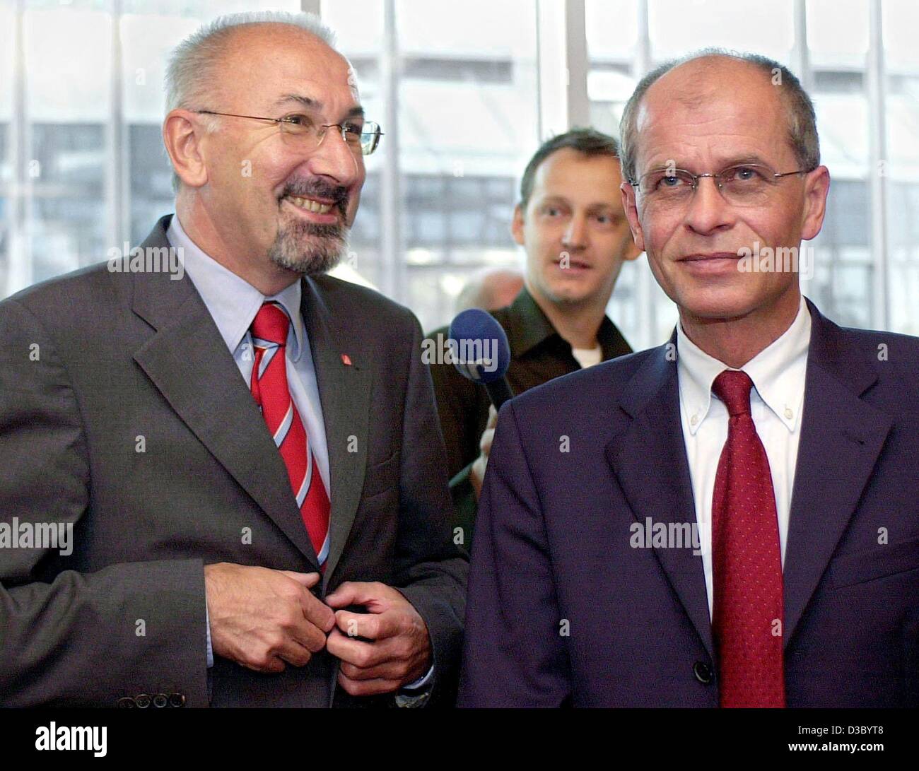 (dpa) - The dual chairmanship of Germany's IG Metall metal workers union consisting of Juergen Peters (L), so far the deputy chairman of the union and Berthold Huber (R), IG Metall's top official in the state of Baden-Wuerttemberg, smile during an extraordinary union meeting in Frankfurt, 23 July 20 Stock Photo