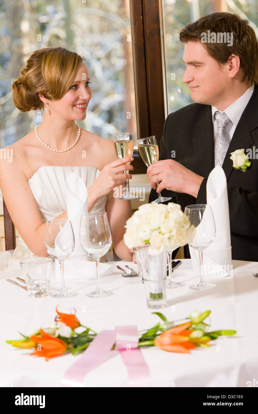 Happy Bride And Groom Toasting Champagne Table Setting And