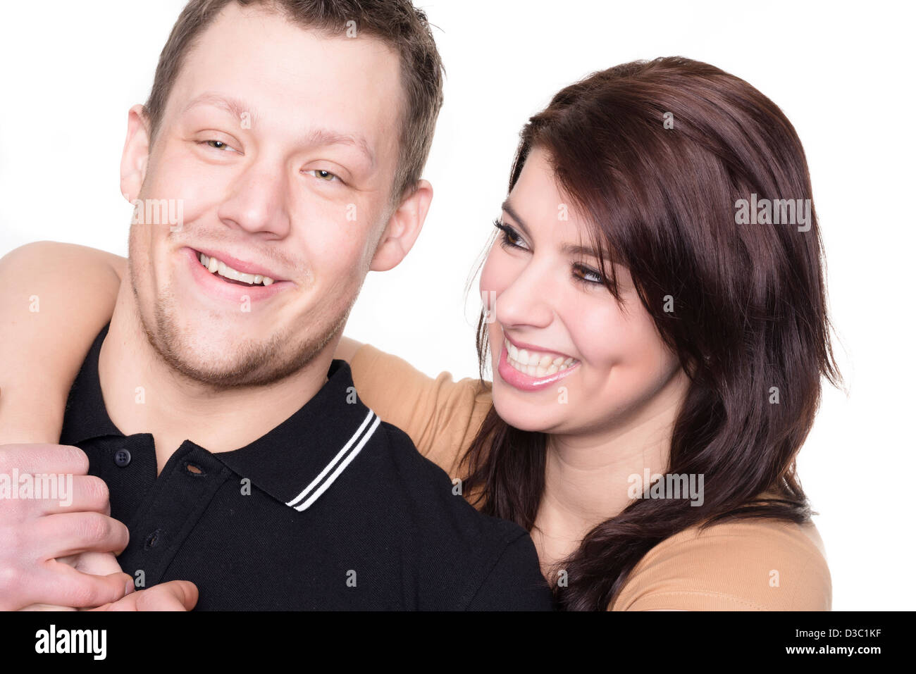Young and happy couple in front of white background Stock Photo - Alamy