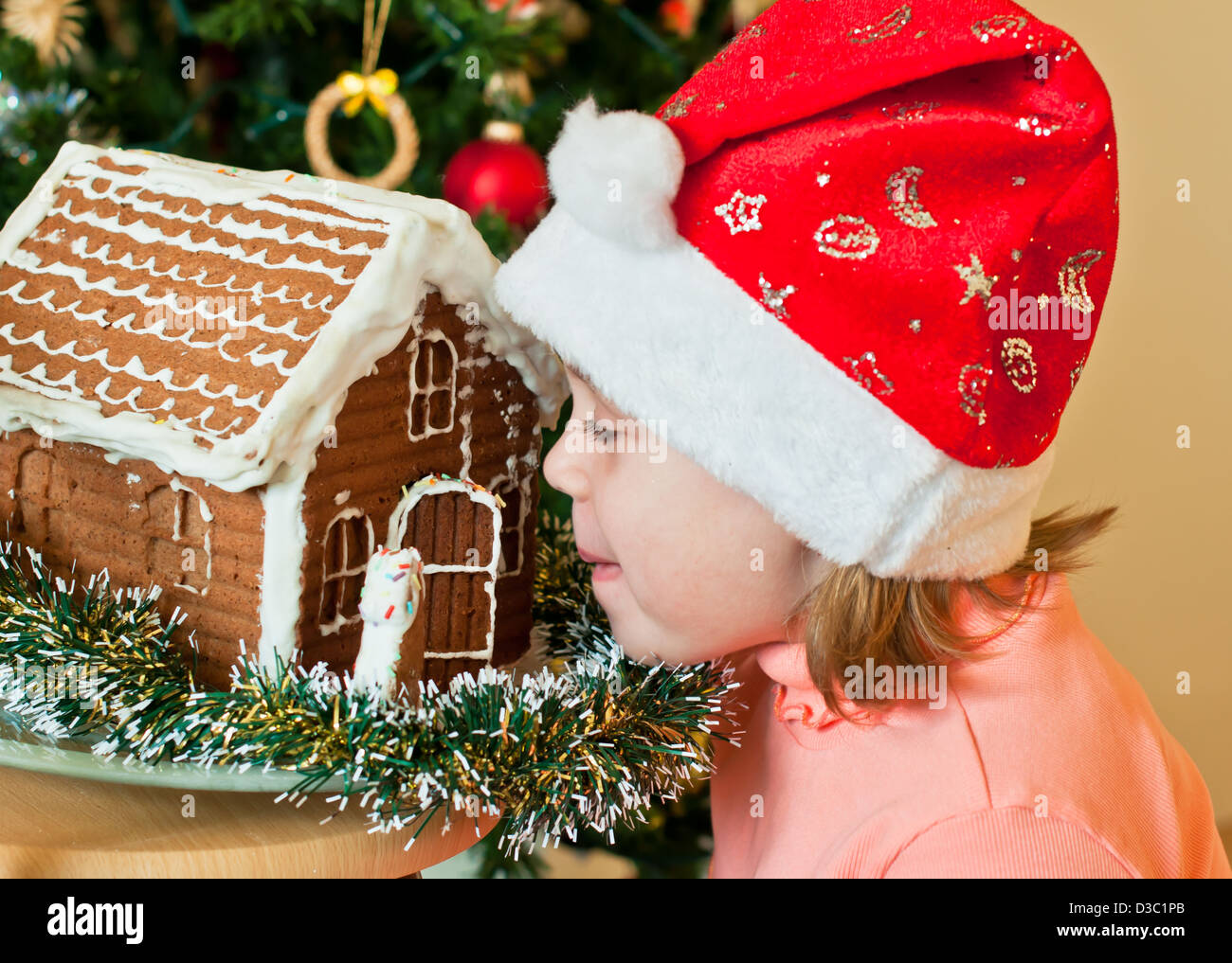 Gingerbread House, Child, Cake, Children Only, Christmas, Built Structure, Window, Childhood, Gingerbread Cookie, Little Girl Stock Photo