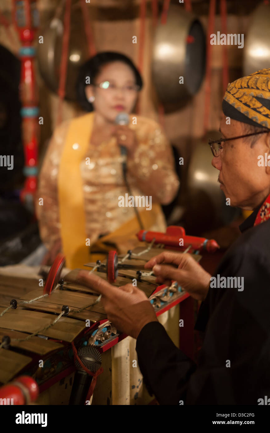 The original Javanese, Indonesian classic musical instrument; Gamelan played by the musician complete with their grand uniforms Stock Photo