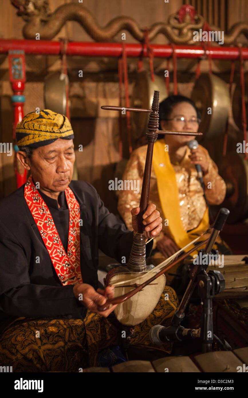 The original Javanese, Indonesian classic musical instrument; Gamelan played by the musician complete with their grand uniforms Stock Photo