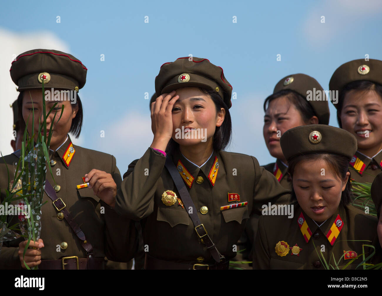 Smiling North Korean Female Soldiers In Tower Of The Juche Idea, Pyongyang, North Korea Stock Photo