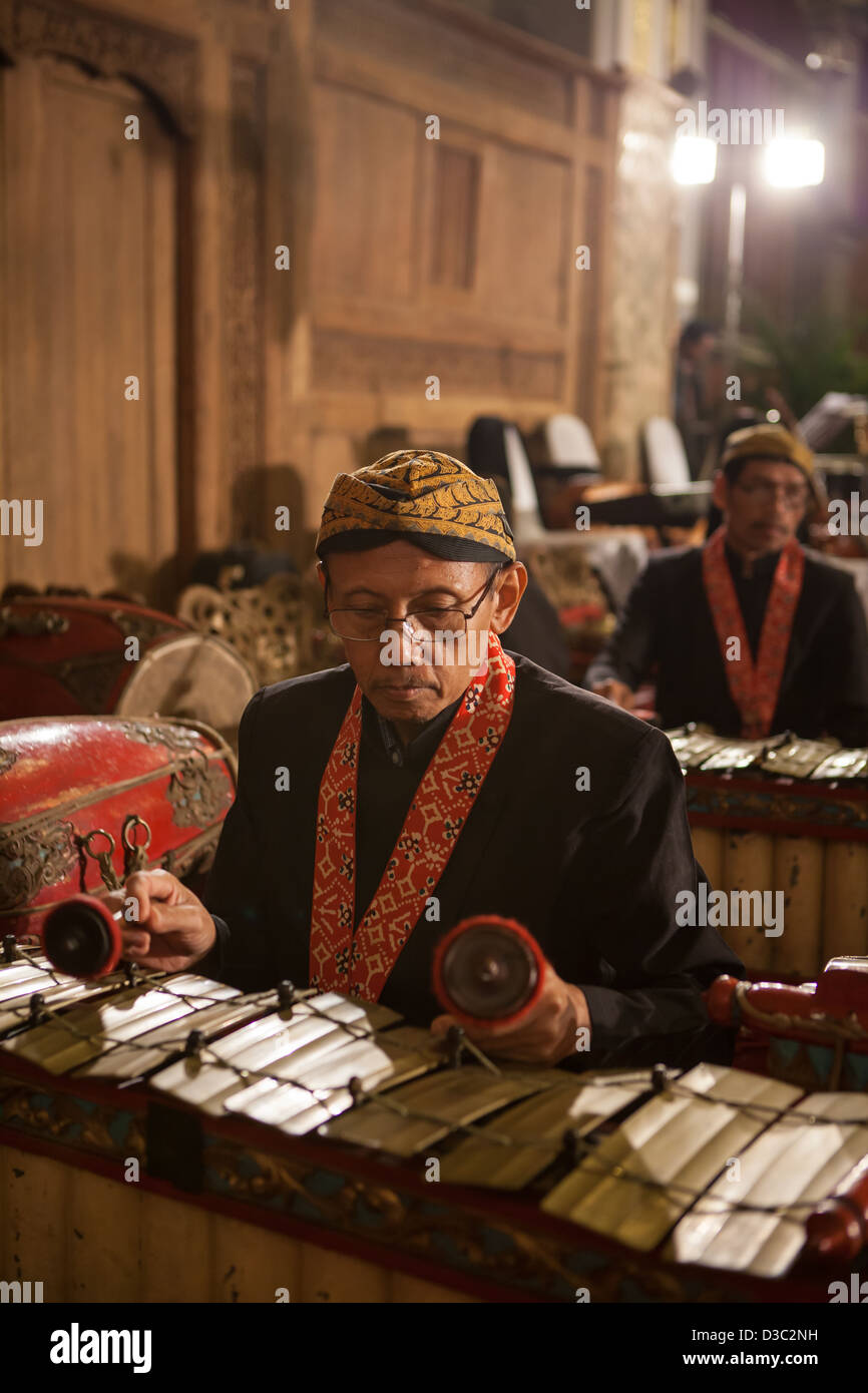 Java Indonesia - 6-5-2012: a Javanese traditional musician performing original GAMELAN ORCHESTRA Stock Photo