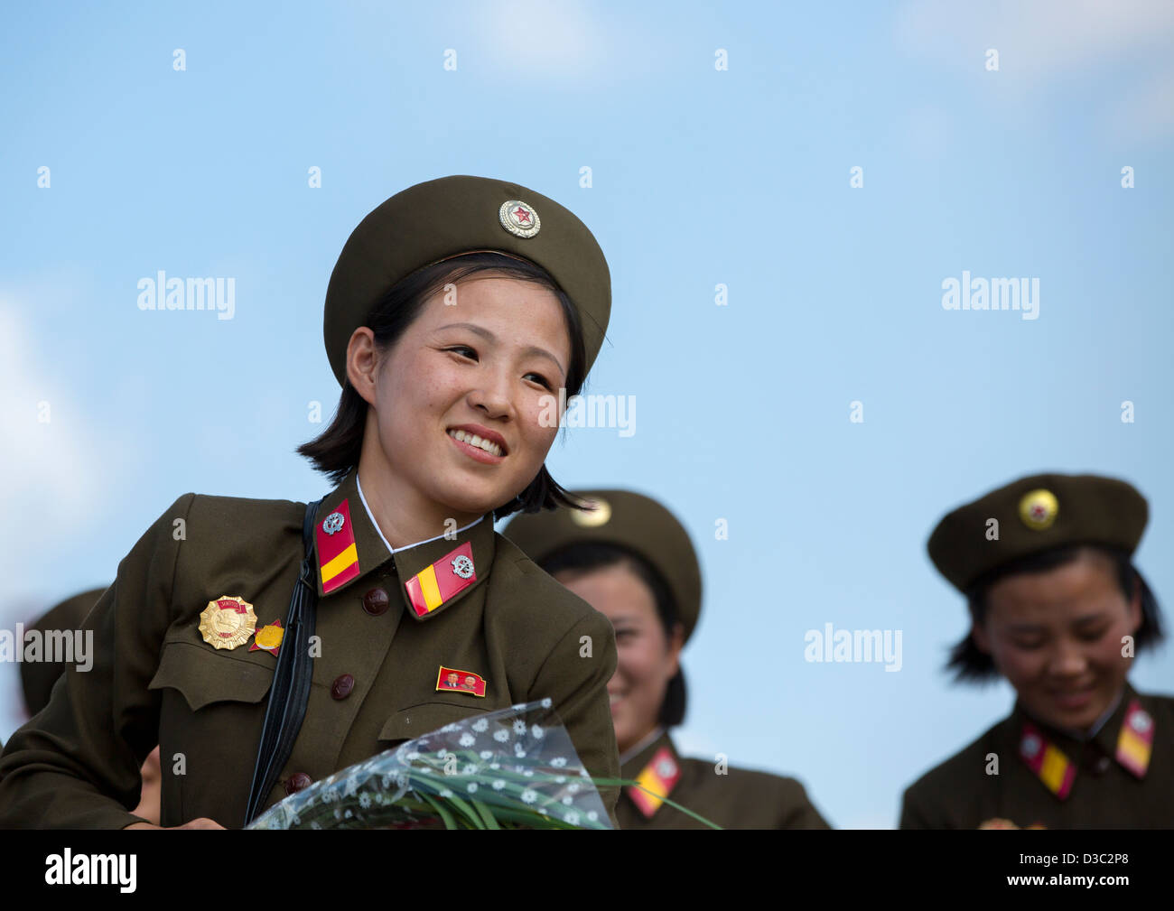 Smiling North Korean Female Soldiers In Tower Of The Juche Idea, Pyongyang, North Korea Stock Photo