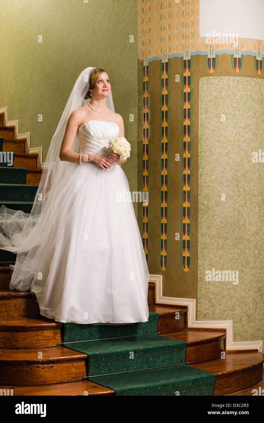 Bride alone on stairs hi-res stock photography and images - Alamy