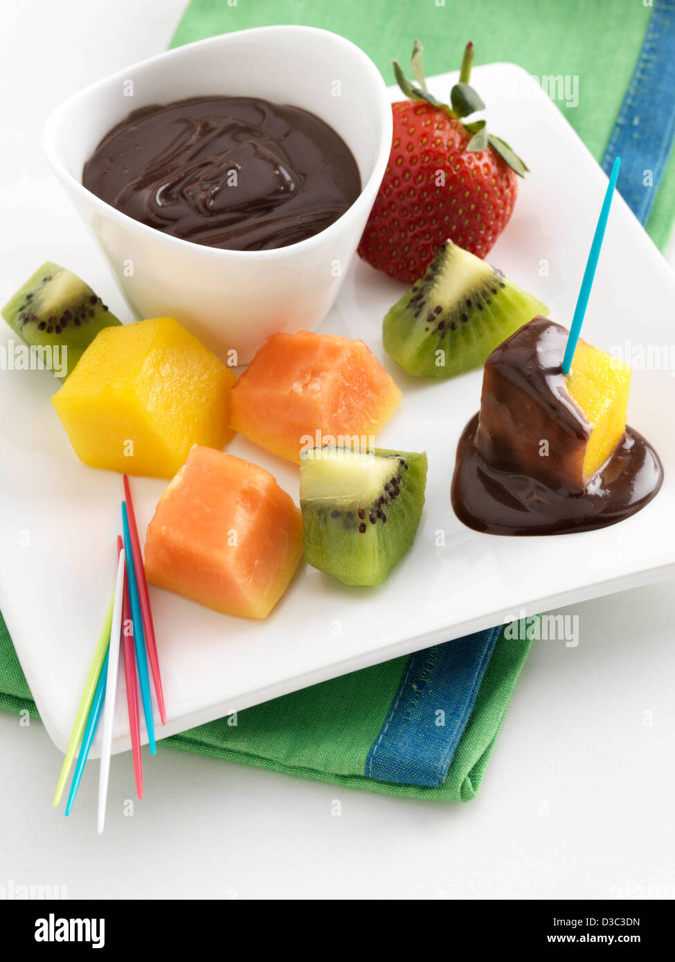 Fruit fondue with chocolate dipping sauce Stock Photo