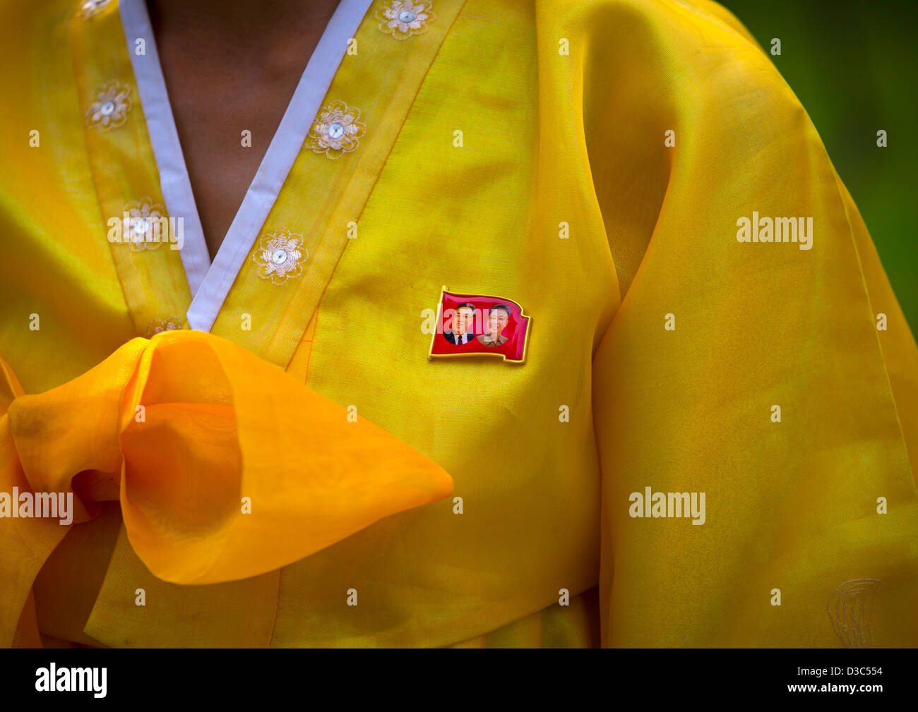 Close-up Of The Dear Leaders Badge On The Traditional Dress Of A North Korean Woman, Hamhung, North Korea Stock Photo