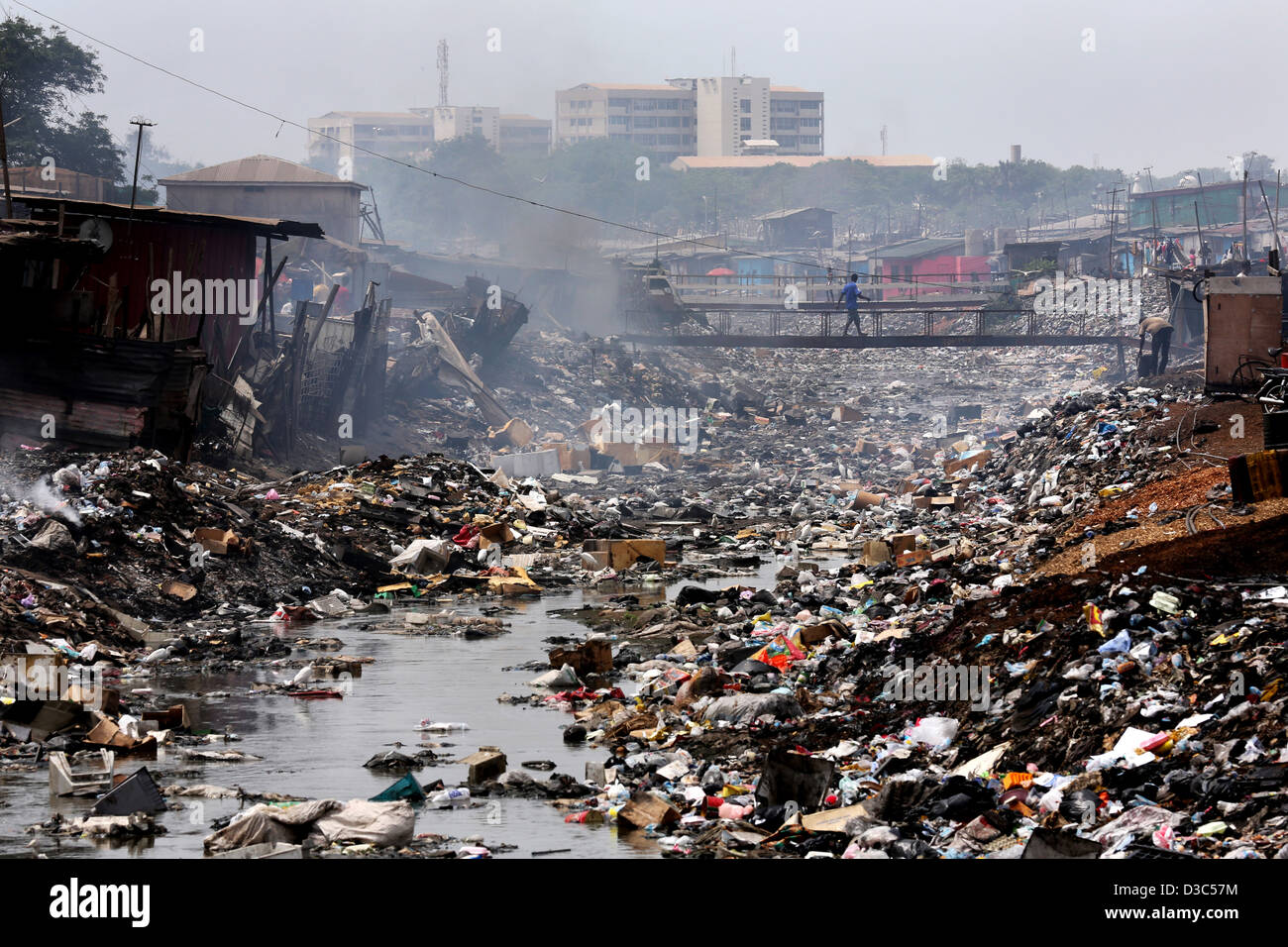 A small river in Accras Agbogbloshie township has become a polluted water body. Stock Photo
