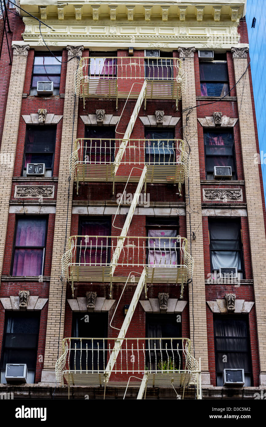 Typical Apartment Building  With Iron Fire Escape In Manhattan,  New York City, USA Stock Photo