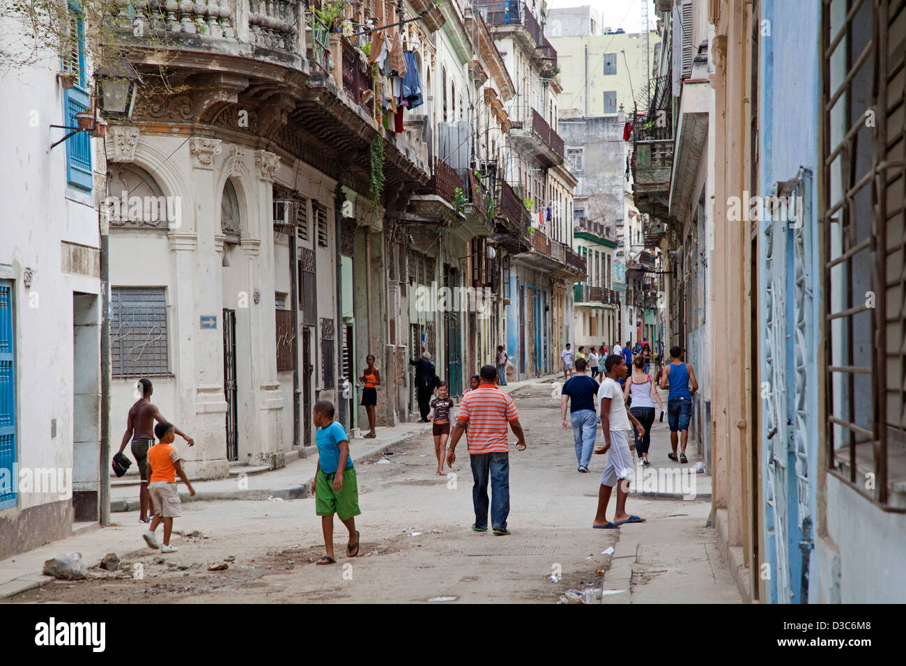 Youngsters in dilapidated street in Old Havana / La Habana Vieja, Cuba, Caribbean Stock Photo