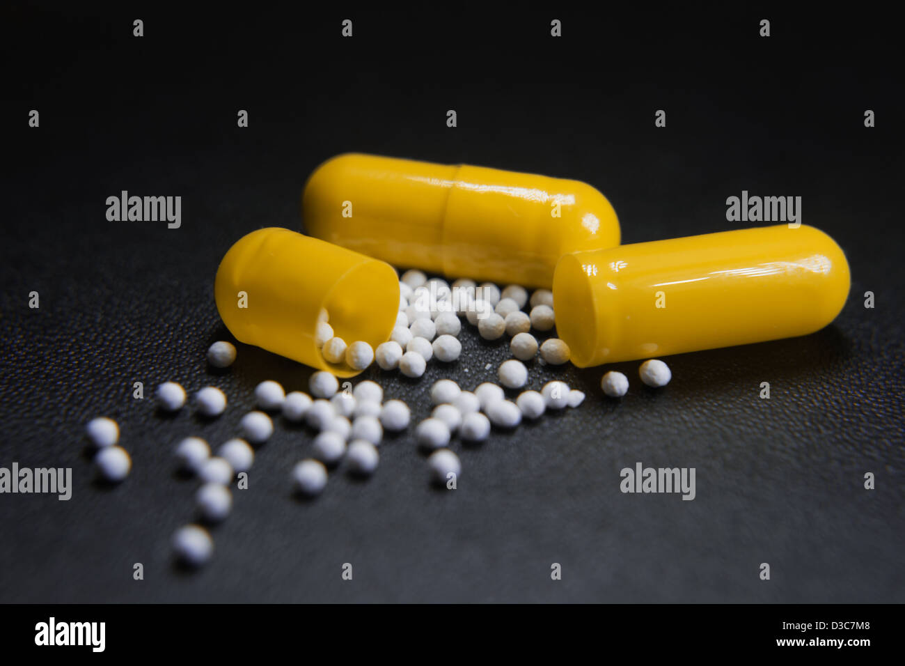 open Yellow capsules Stock Photo Alamy