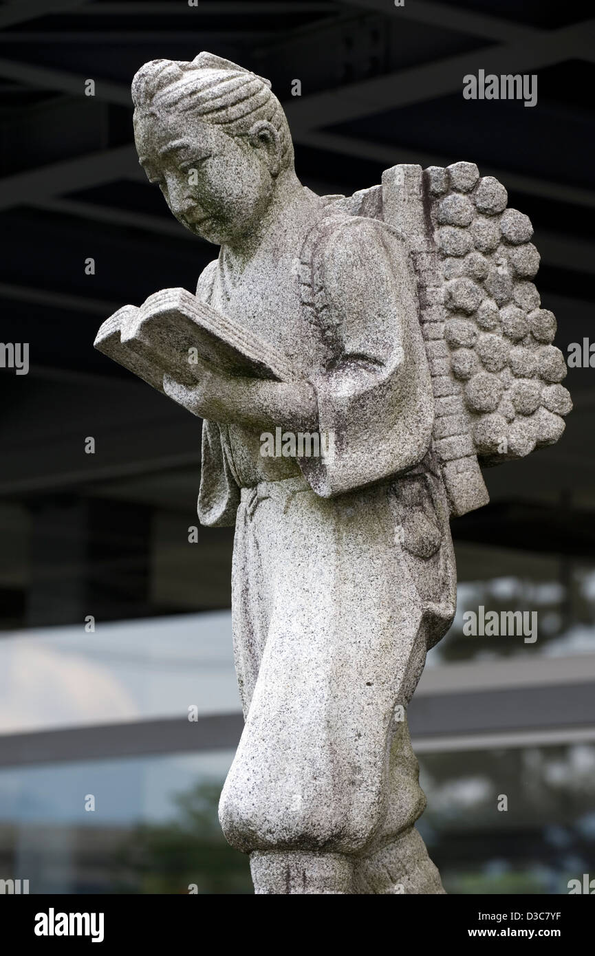 Stone statue of Ninomiya Sontoku, Japanese philosopher, moralist and economist, found in front of elementary schools in Japan Stock Photo