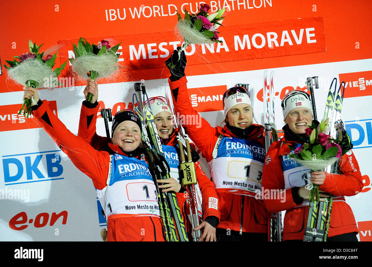 From left Hilde Fenne, Ann Kristin Flatland, Synnoeve Solemdal and Tora Berger of Norway celebrate after they won women´s relay (4x6km) race at the Biathlon World Championships in Nove Mesto na Morave, Czech Republic, Friday, Feb. 15, 2013. (CTK Photo/Lubos Pavlicek) Stock Photo