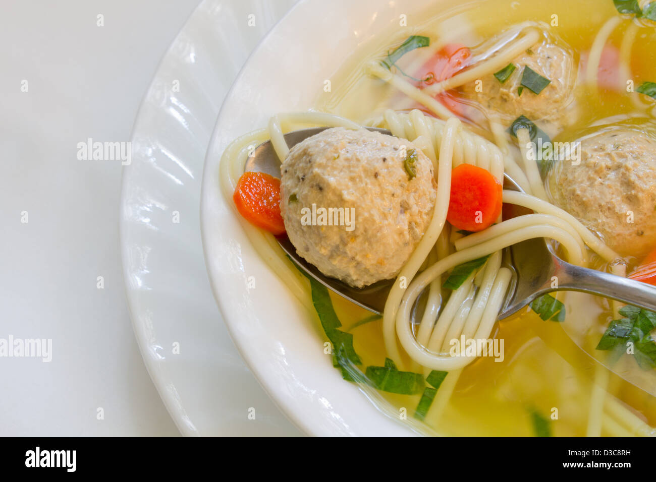 Chicken soup with meat balls and noodles. Stock Photo