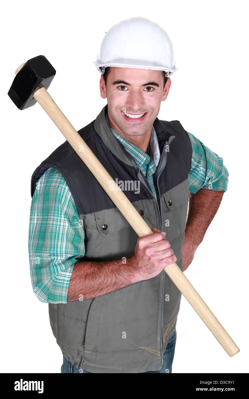 Cheerful worker with a sledgehammer Stock Photo Alamy