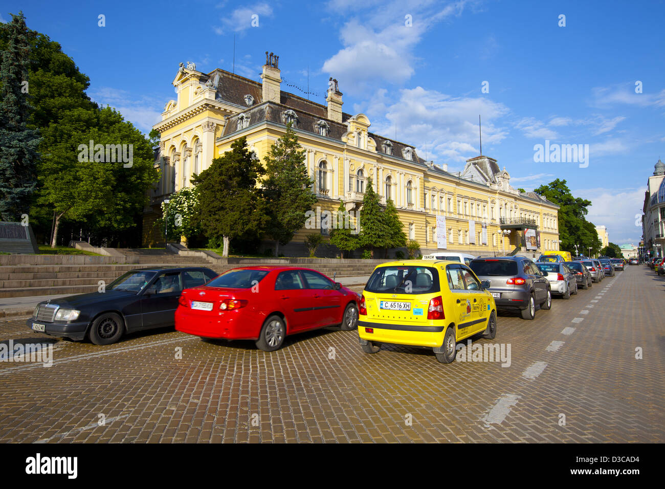 Bulgaria, Europe, Sofia, Traffic On Knyaz Al. Battenberg Square In Front Of National Art Gallery. Stock Photo