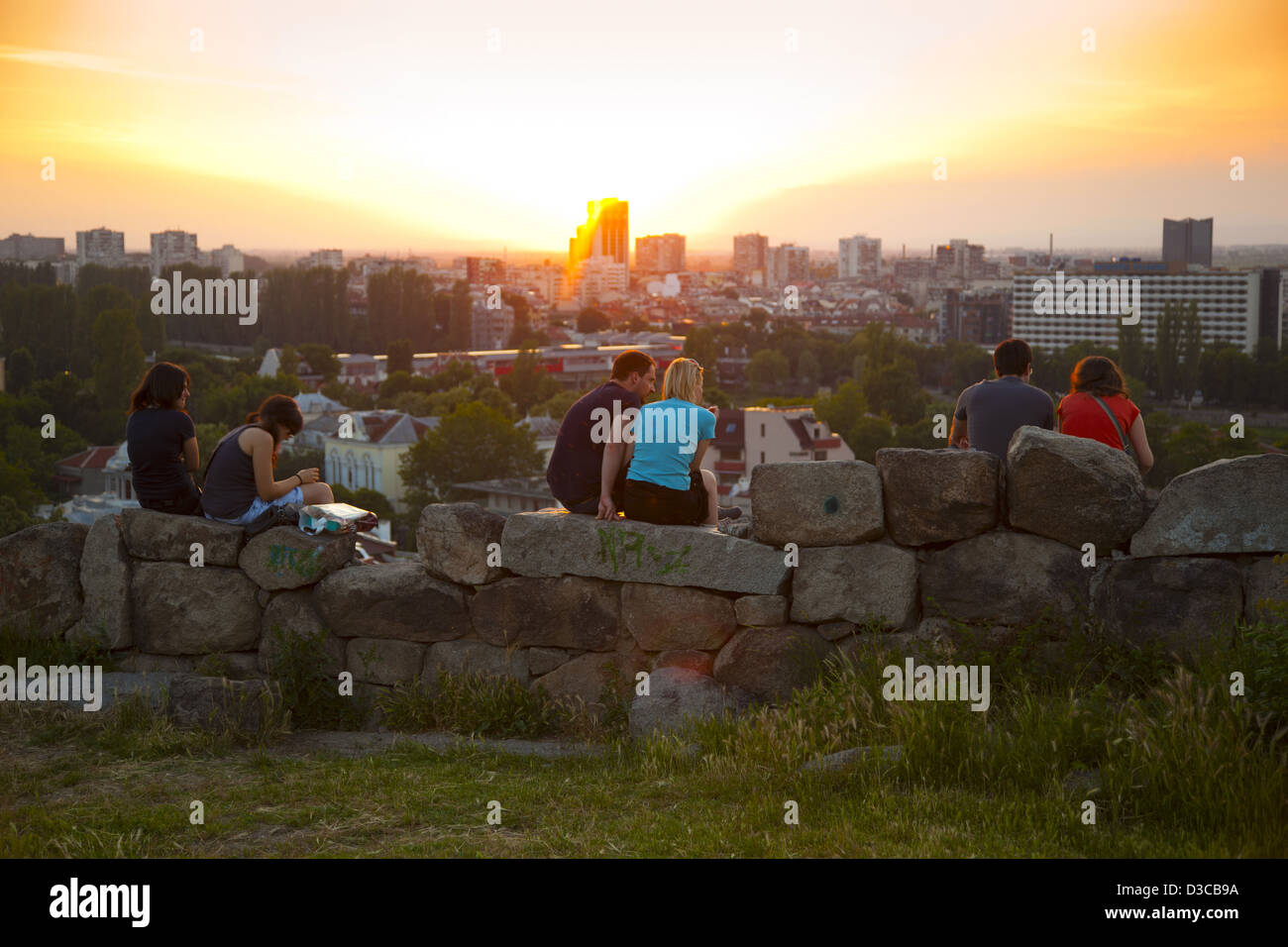Bulgaria, Europe, Plovdiv, Sightseers Viewing Western Plovdiv From Nebet Tepe, Prayer Hill, Sunset. Stock Photo