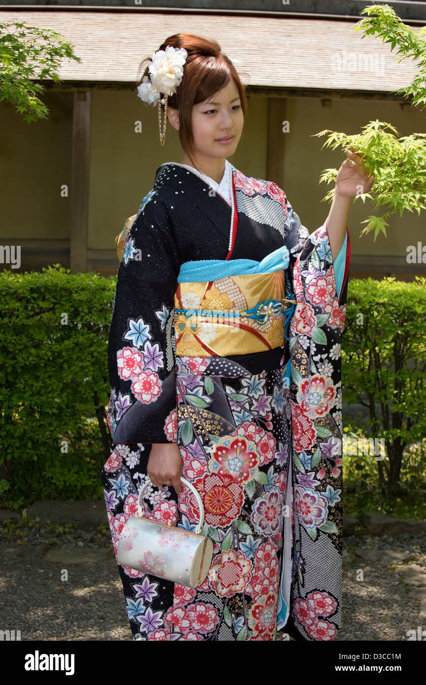 Cute, 20-something Japanese girl wearing traditional furisode long-sleeve  kimono with spring flower design poses in Fukui, Japan Stock Photo - Alamy