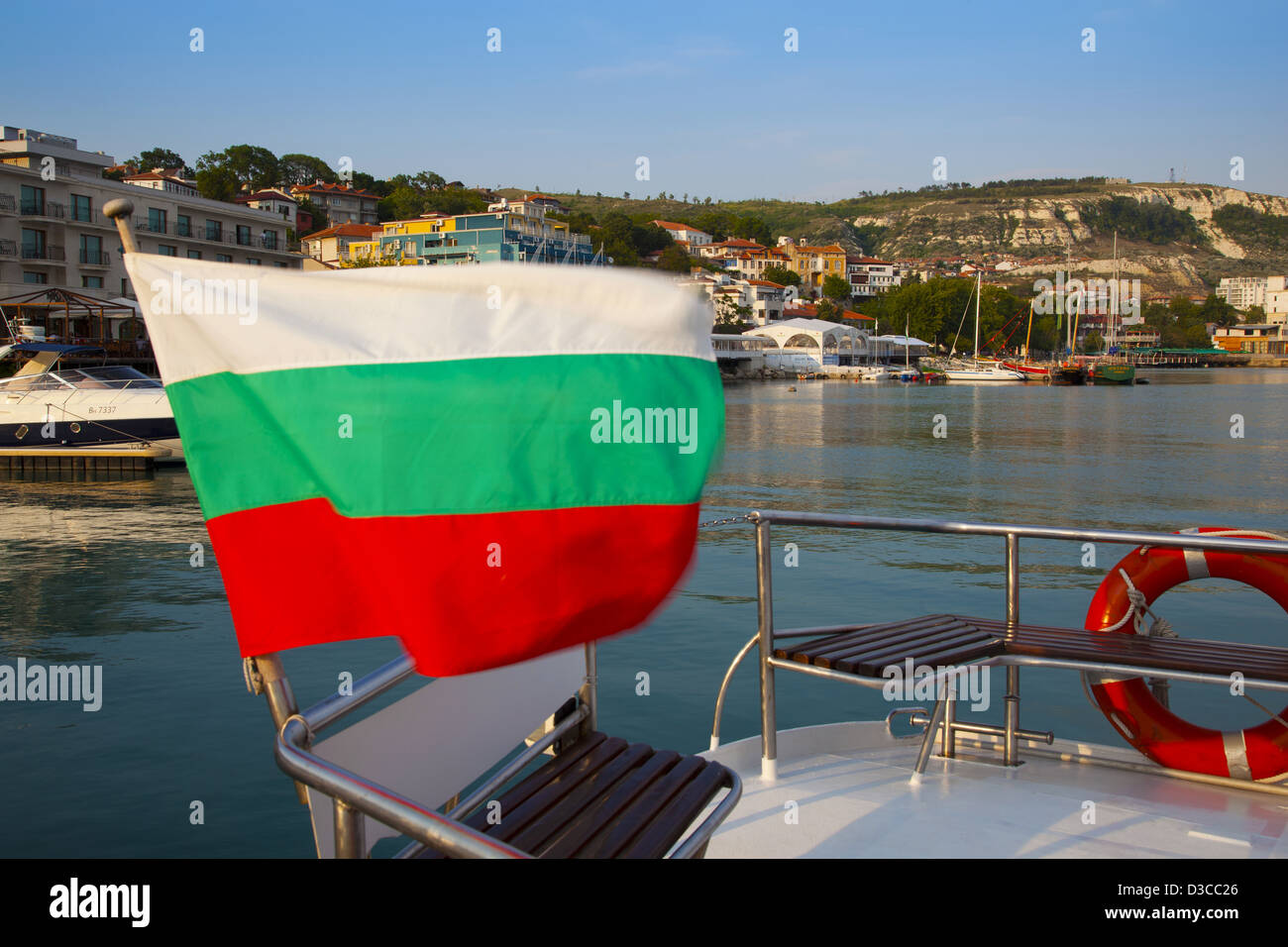 Bulgaria, Europe, Black Sea, Seaside Town Of Balchik, Bulgarian Flag Waving On The Stern Of A Yacht Moored In The Harbor Stock Photo