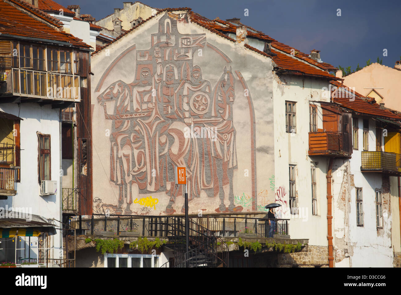 Bulgaria, Europe, Veliko Tarnovo, Houses, Plaster Artwork Decorating A Building Wall To Commemorate An Historical Event. Stock Photo