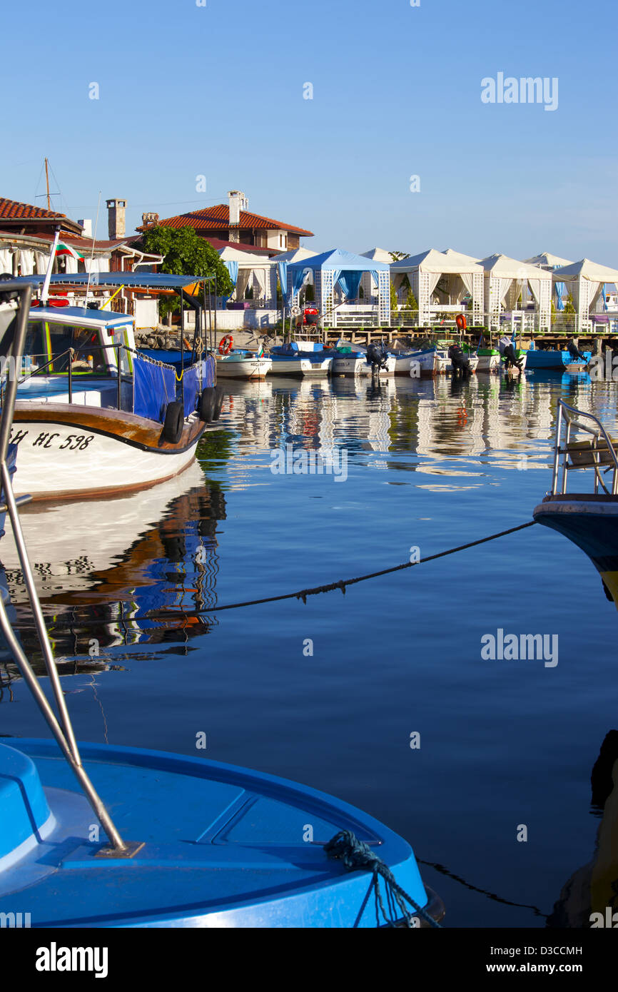 Bulgaria, Europe, Black Sea, Nessebar, Seaport, Harbor, Moored Boats And Outdoor Restaurant Along The Quay. Stock Photo