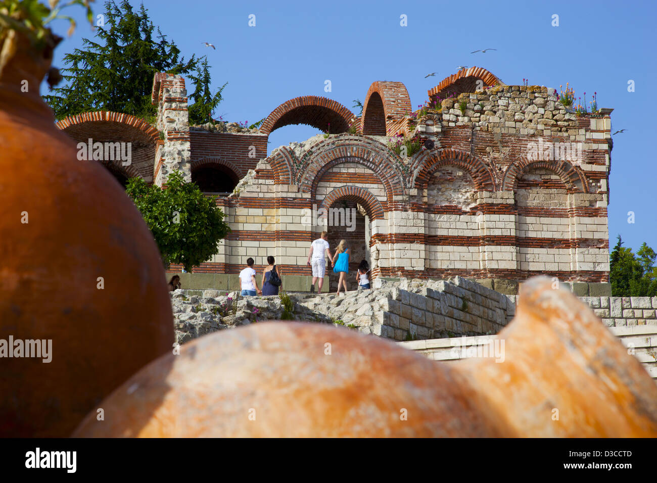 Bulgaria, Europe, Black Sea, Nessebar, Ruins Of The Church St. John Aliturgetos, Pottery In The Foreground, Sightseers. Stock Photo