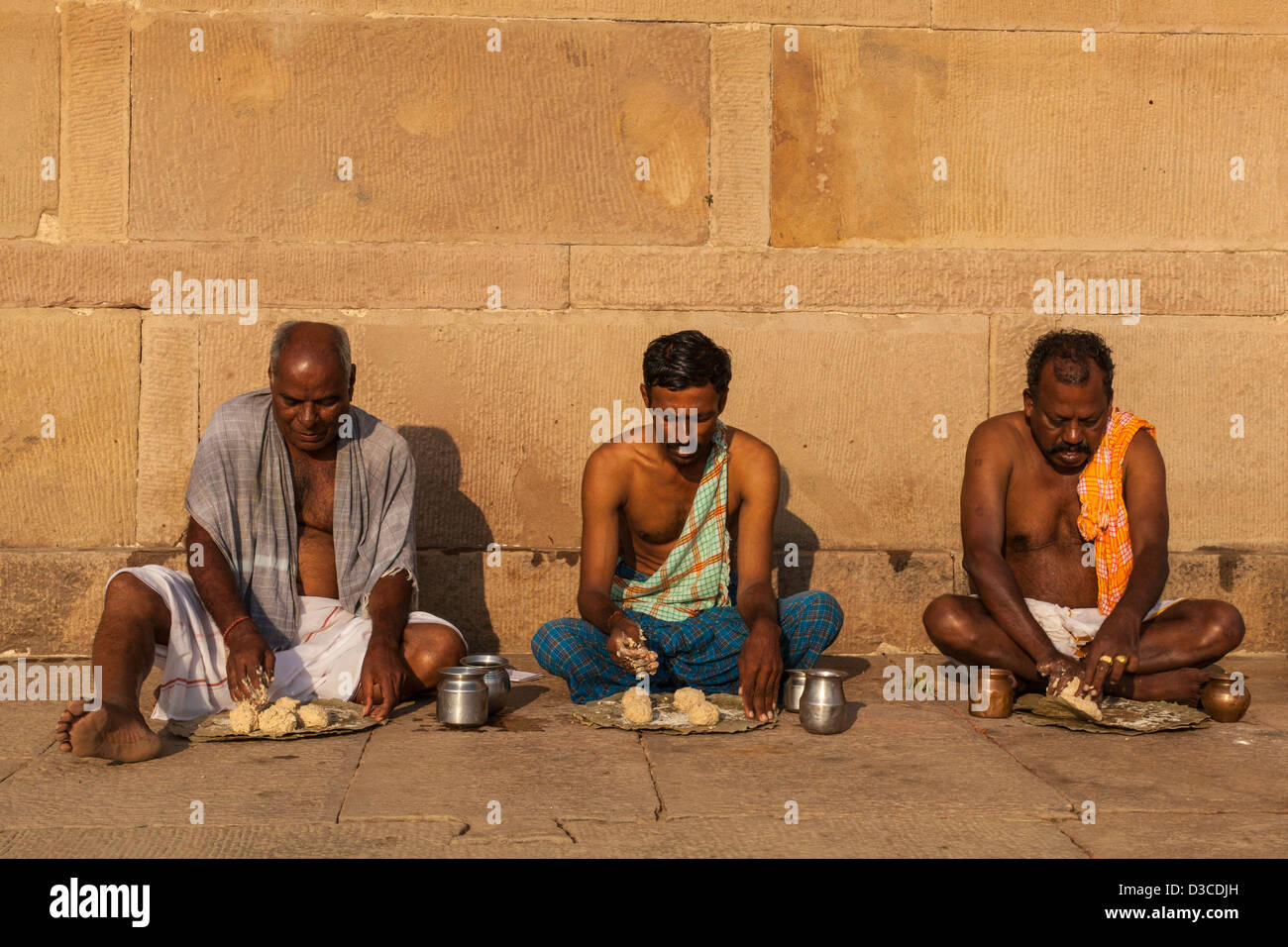 men preparing Chapatis, Varanasi, India Stock Photo