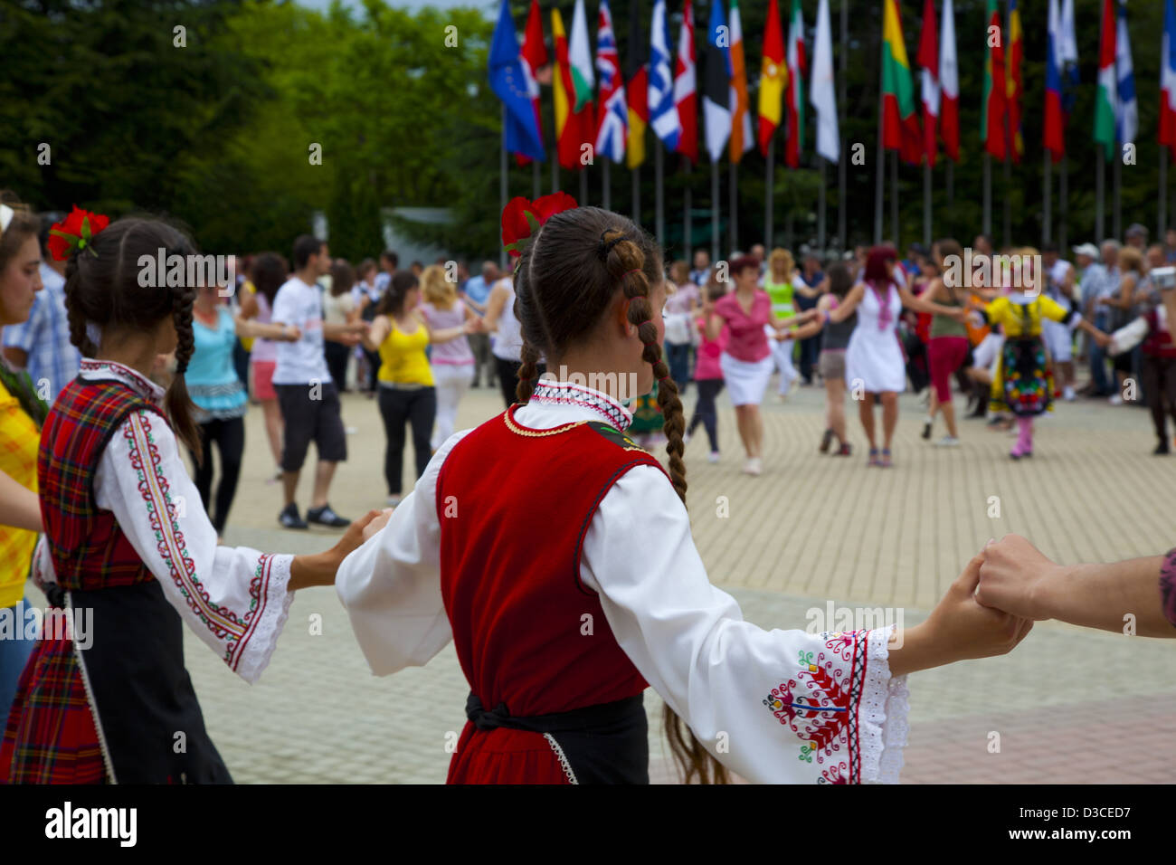 Bulgaria, Europe, Kazanlak, Flower Festival Parade, Girls Dancing In Their Traditional Costumes. Stock Photo