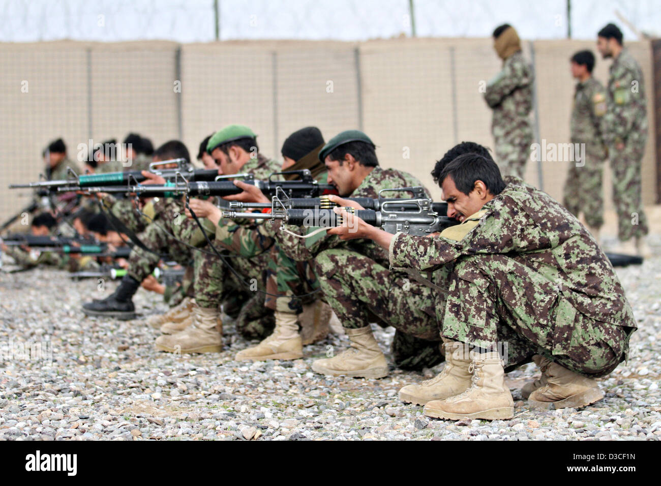 Afghan National Army soldiers practice shooting during training by